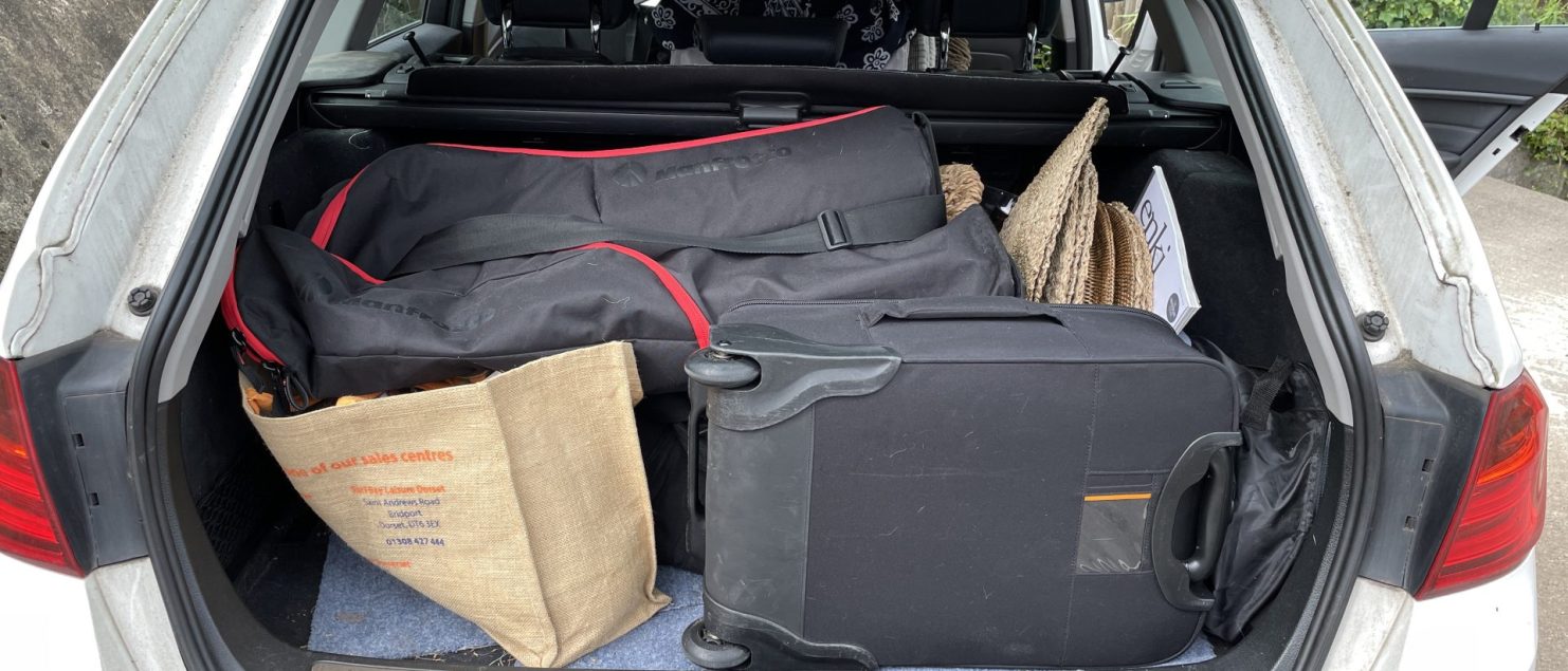 photographic gear and staging props packed in the car